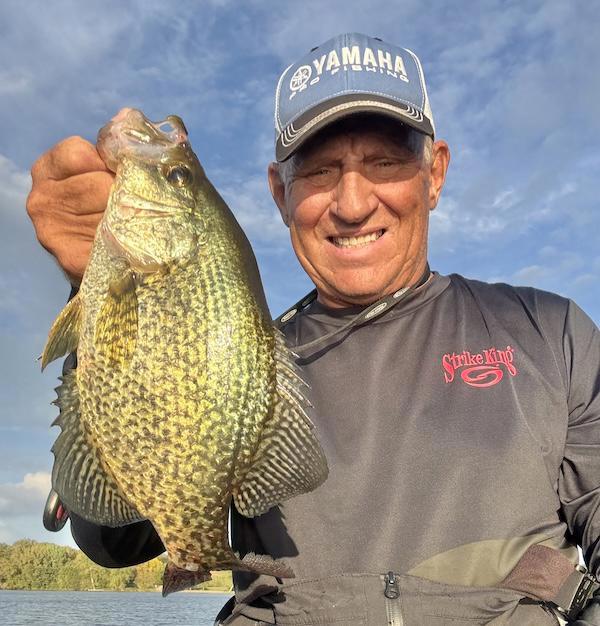 Mike Frisch holding up catch